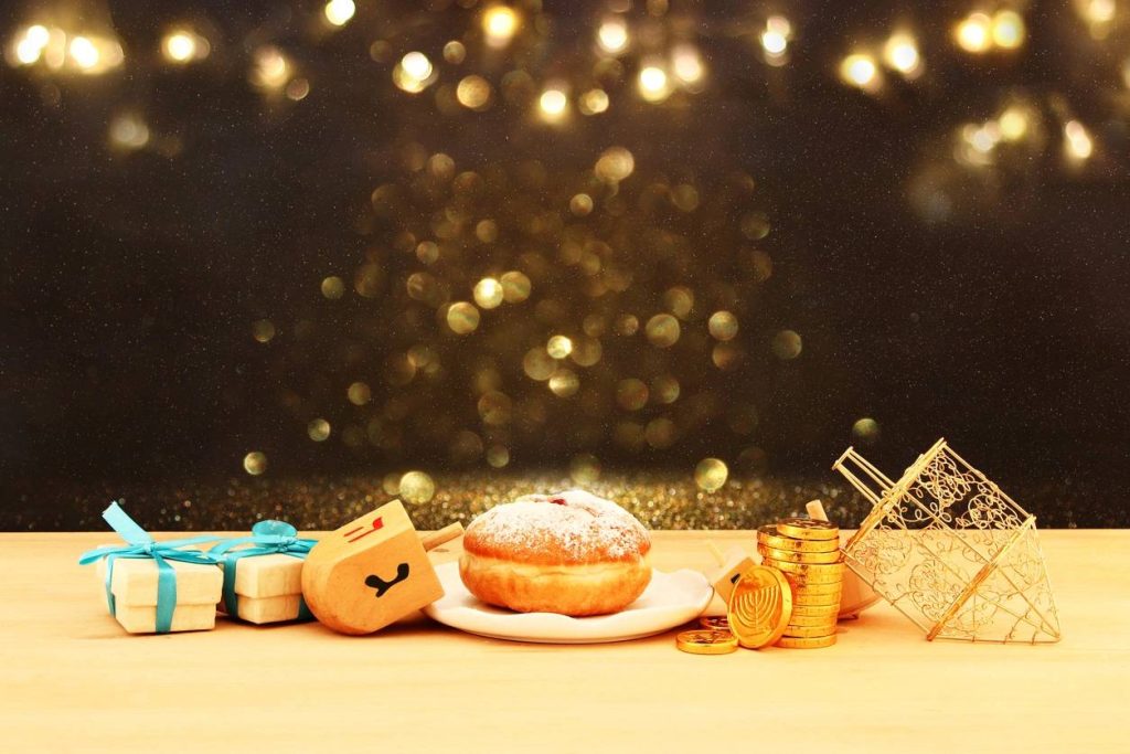 Image of jewish holiday Hanukkah with wooden dreidels (spinning top) and donut on the table (Image of jewish holiday Hanukkah with wooden dreidels (Image of jewish holiday Hanukkah with wooden dreidels (spinning top) and donut on the table (Image of j SSUCv3H4sIAAAAAAAEAJ2RwY6DIBCG75vsOxjOmpRai+6rND2MMLGTWmkAu2ka331BNJnz3vi/nxnmHz7fX0UhevCkxU/xSSpqGsfZBweB7BTxodw4GgrWEYwJJrasjvABwuzRpxYb0hBwiHcz3Or3dy5ZF7uxmrEiWkKUjPm5X9mOlvLflflw3aPAgJN+rwOzIA5HhBzkkq+K+29A9+DRXmTQMg2zIctSvqyGMRXUrPPTkaZpYGU23NDxj